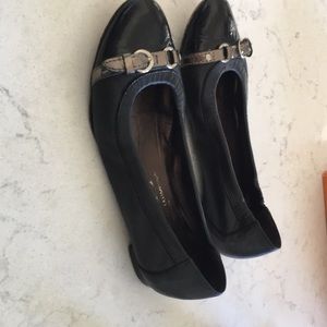 Black patent and leather AGL flats.